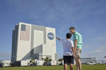 father and son at the Vehicle Assembly Building at Kennedy Space Center